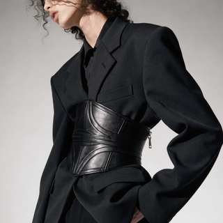 Black leather corset belt over a blazer