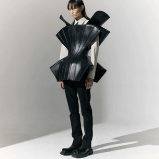 Structured black leather corset trend — Restrict